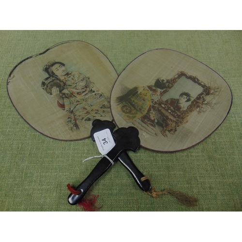 34 - Pair of Oriental hand fans, having lacquered handles.