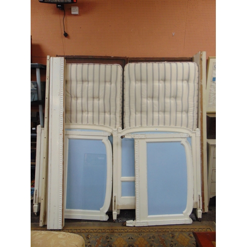 342 - Pair of continental painted single bedsteads, including mattresses.