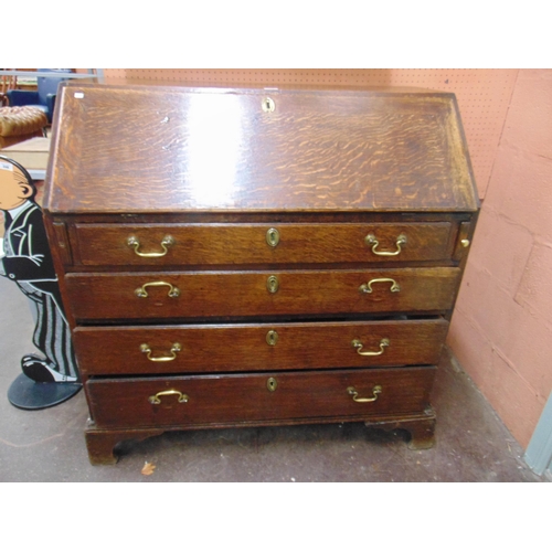 379 - Antique oak bureau, fall front revealing a fitted interior, four long graduated drawers with brass s... 