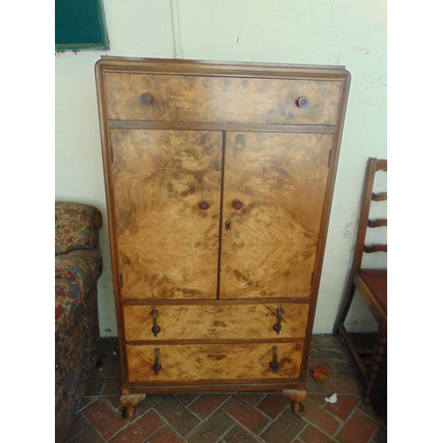 398 - Art deco walnut veneered two piece bedroom suite, comprising mirror back dressing table and tallboy.