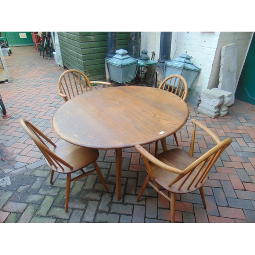 400 - An Ercol Golden Dawn dining suite, comprising drop leaf table and four stick back chairs (2+2).