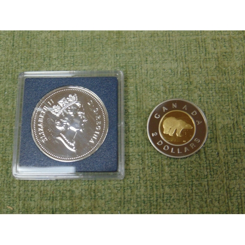 435 - Cased Canadian $2 1996 coin, together with a commemorative $1 coin. (2).