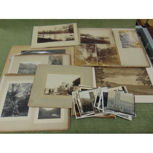 54 - Collection of unframed black and white pictures.