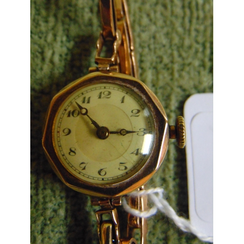 11 - Gold plated ladies wrist watch.