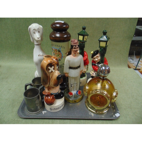 112 - Collection of novelty and musical decanters.