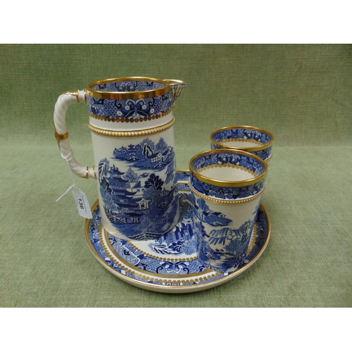 136 - Davenport Longport willow pattern gilt edged caberet set, comprising jug, two beakers and circular t... 