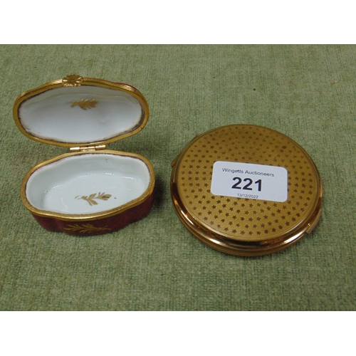 221 - Limoges gilt and floral decorated oval trinket box, together with a bird decorated powder compact.