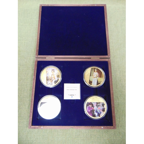 223 - Cased set of four proof commemorative coins.