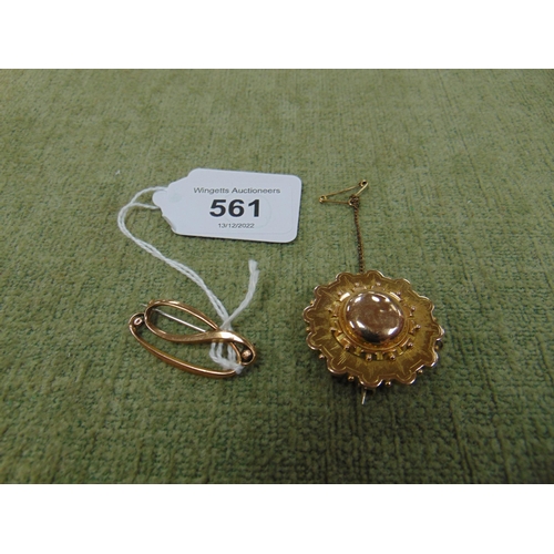 561 - 9ct gold brooch, together with a possibly gold circular brooch (2).