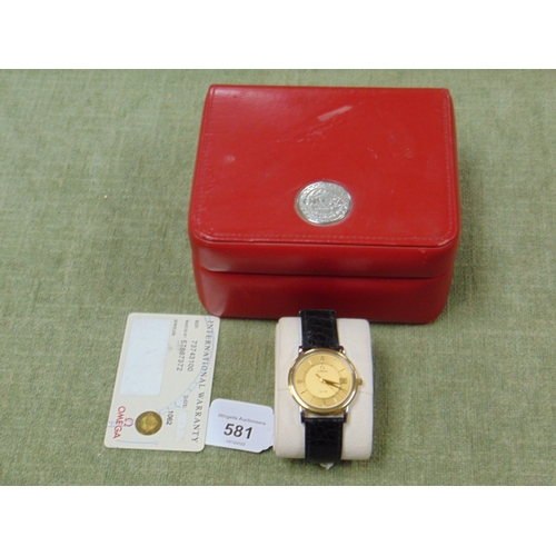 581 - Omega De Ville yellow gold quartz gents wrist watch in box.