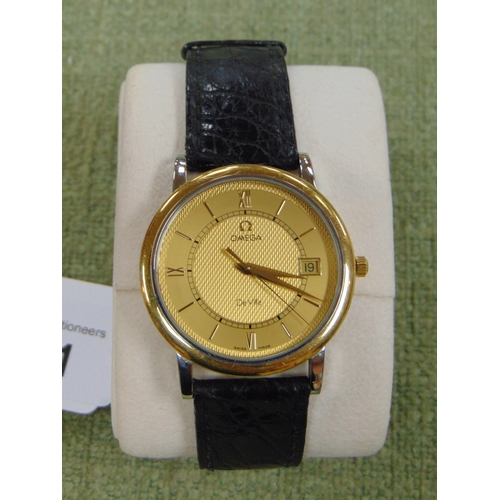 581 - Omega De Ville yellow gold quartz gents wrist watch in box.