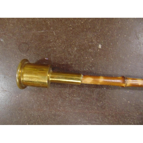 586 - Bamboo staff, having brass terminal. 73.5