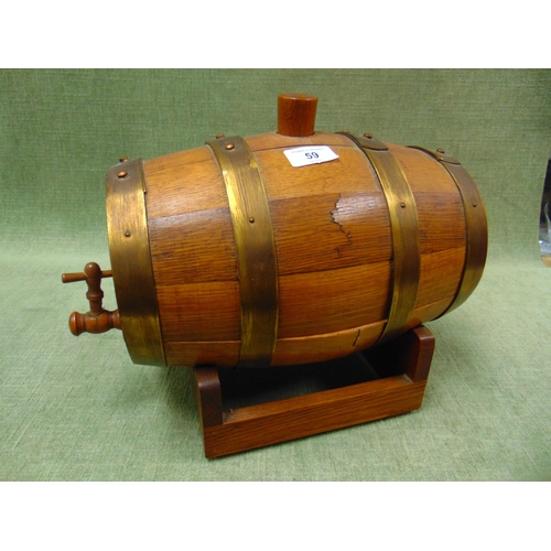 59 - Brass bound barrel on stand, having wooden tap. 11 x 12