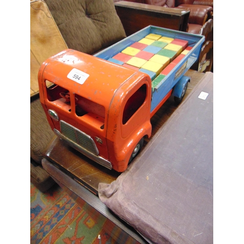 594 - Vintage Triang tipping lorry, together with a quantity of wooden building blocks.