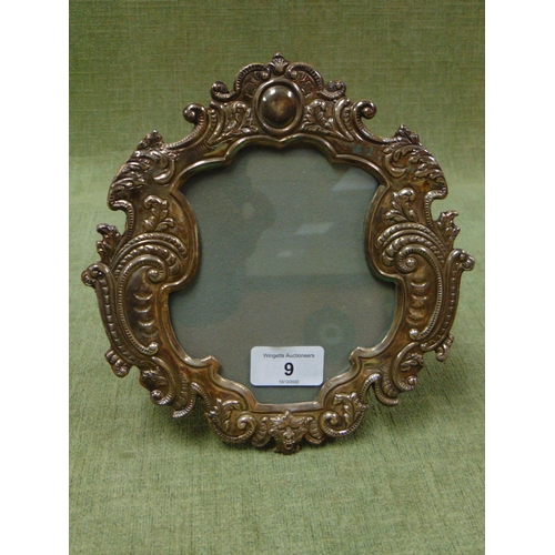 9 - Continental silver plated frame of shaped design.