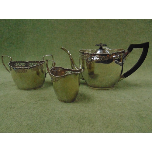 104 - EPNS three piece plated tea service, having pierced decoration.