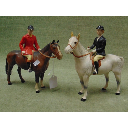 107 - Two Beswick hunter horses, each having figures sat atop. Both (F).