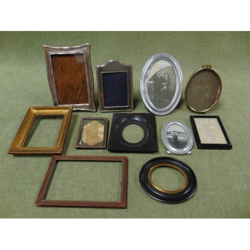 115 - Silver photograph frame together with a collection of other frames.