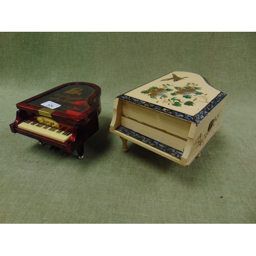 124 - Two novelty piano form jewellery boxes.