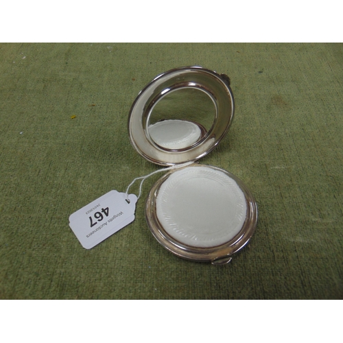 467 - Art deco silver powder compact, having mirrored interior.