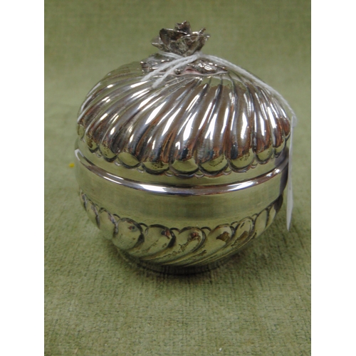 473 - Continental silver lidded pot, having floral mount and gadrooned decoration.