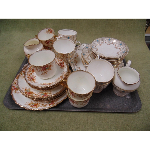 69 - Floral decorated tea set and one similar example. (2)