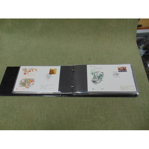 72 - First day cover album and contents.