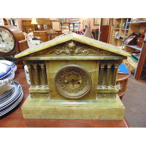 480 - An onyx antique mantle clock, having Arabic numerals.