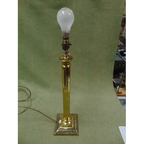 11 - Ornate brass column form table lamp, set on stepped base. 22