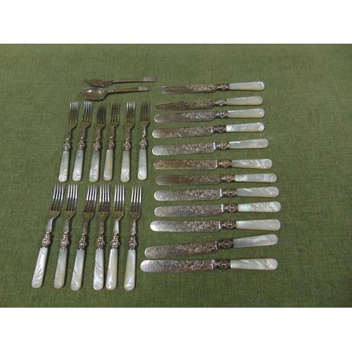 149 - Set of 12 mother of pearl handled knives and forks.