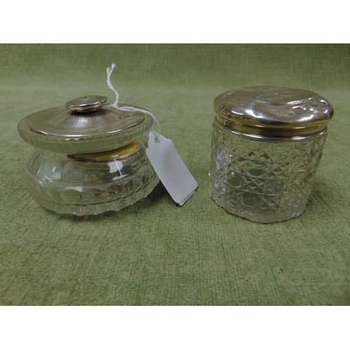 151 - Birmingham silver mounted dressing table jar and one similar example.