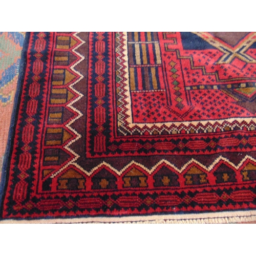 191 - Red ground modern Persian prayer rug, having geometric pattern, 74 x 44