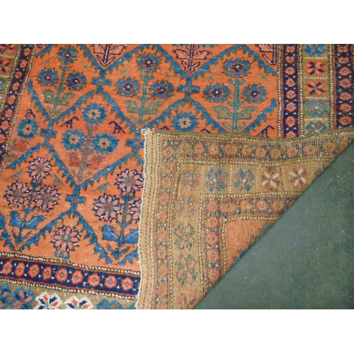 21 - Persian red and blue ground rug, having geometric pattern. 85 x 50