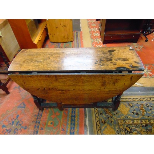 290 - Antique oak gateleg table, drop leaves, end drawer on turned supports and stretchers. 28 x 43 x 16