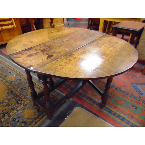 290 - Antique oak gateleg table, drop leaves, end drawer on turned supports and stretchers. 28 x 43 x 16