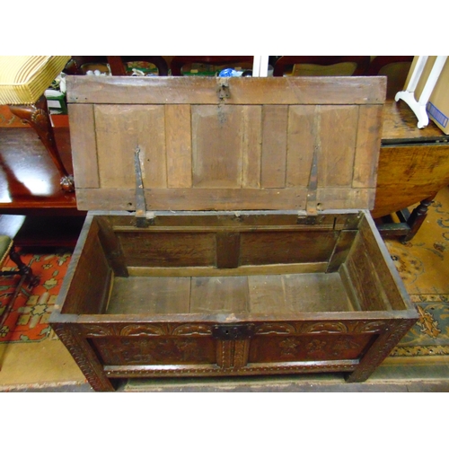 302 - Antique oak coffer, having all over carved decoration, lift up triple panel lid, further panels to f... 