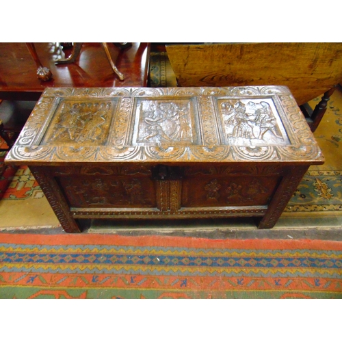 302 - Antique oak coffer, having all over carved decoration, lift up triple panel lid, further panels to f... 