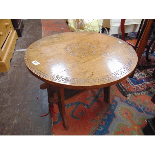 305 - Small oak drop leaf table,  having carved decoration. 19 x 23 x 12