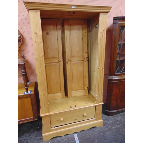 334 - Modern pine wardrobe, ogive cornice above a pair of doors, single drawer, and on platform base. 76 x... 