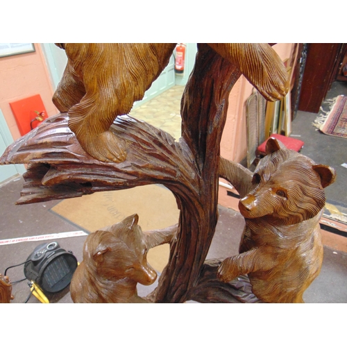 345 - Black Forest type wooden carved figure group, modelled as a bear and three cubs. 61