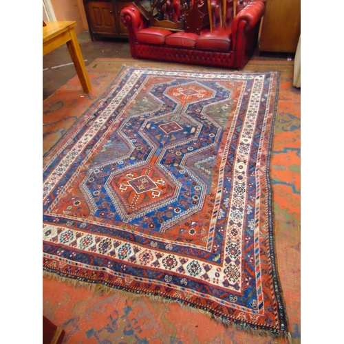 5 - Good Persian blue and red ground rug having geometric pattern. 117 x 83