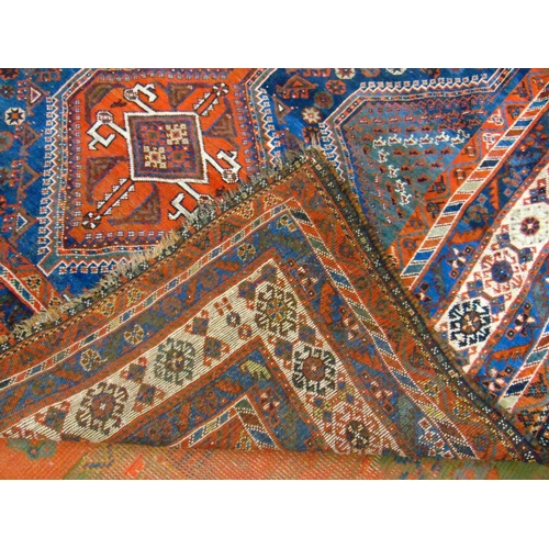 5 - Good Persian blue and red ground rug having geometric pattern. 117 x 83