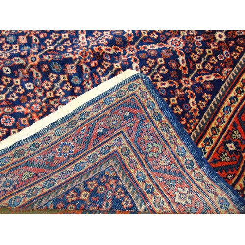 6 - Persian blue ground rug, having all over floral pattern. 80 x 54