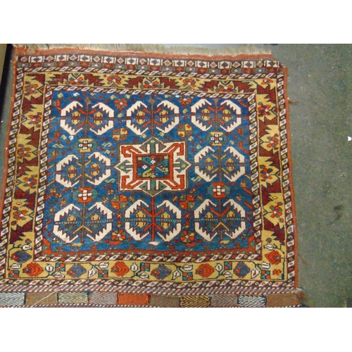 62 - Small Persian red, yellow and blue ground rug. 28 x 30