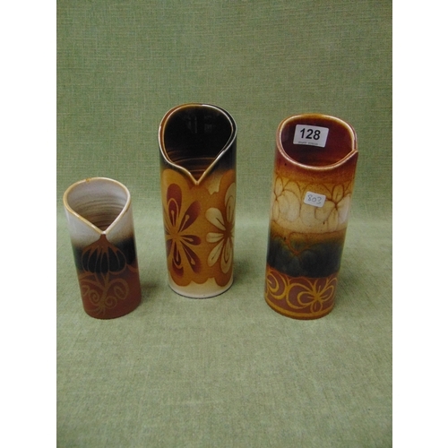 128 - Three studio Poole vases.