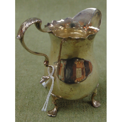 17 - Victorian silver milk jug having scroll handle and on pad feet, maker Mappin and Webb, London 1897. ... 