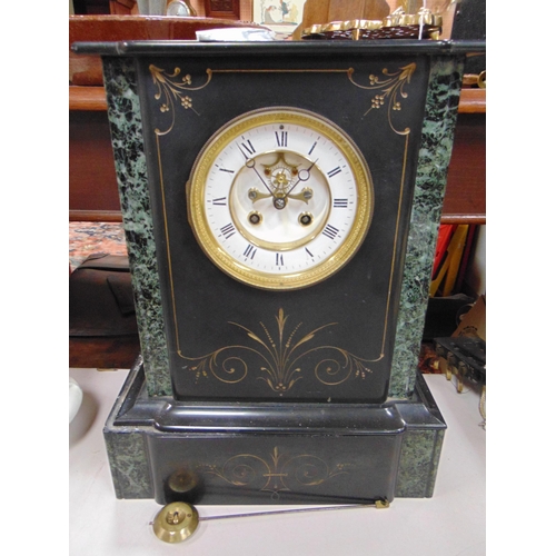 213 - Antique black slate mantle clock, having enamel face and Roman numerals. 15 x 11.5 x 5