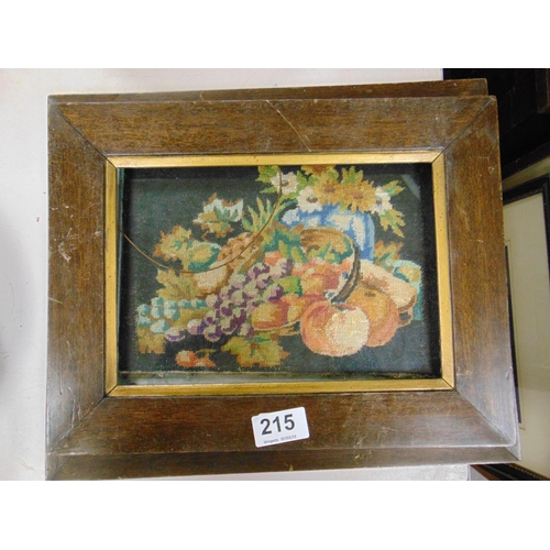 215 - Two framed and glazed needleworks, still lifes of fruit and flowers.