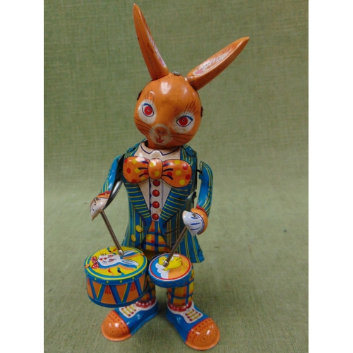 217 - Retro tin plate clockwork drumming rabbit figure.