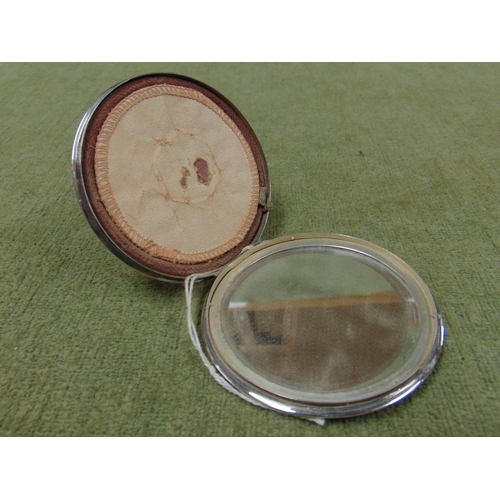 29 - Art deco circular powder compact, having mirrored centre, marked silver.